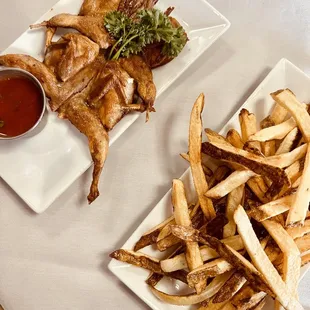 a plate of chicken and french fries