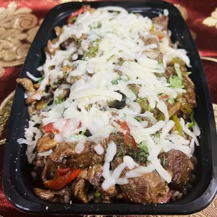 &quot;Experience the Kavsar Special Dish, featuring your choice of beef or chicken, skillet browned and then stewed with sautéed vegetables inclu