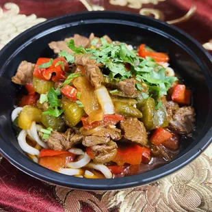 &quot;Lagman: Enjoy our special homemade noodles with your choice of beef, chicken, or a vegetarian option featuring vegetables and mushrooms. Th
