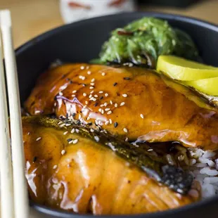 Grilled Salmon Bowl - Teriyaki grilled salmon, seaweed salad, and oshinko over rice