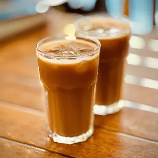 Iced Americanos with oat milk.