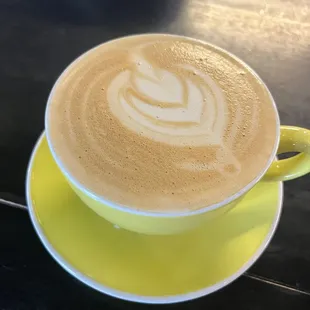 Decaf oat milk latte with maple &amp; vanilla, half sweet