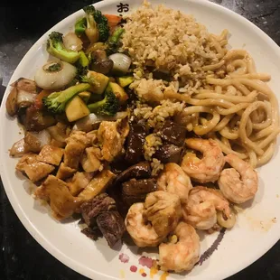 Our completed dish of Hibachi for two. Steak, Shrimp, Chicken, fried rice, vegetables add Udon noodles.  Some eaten already