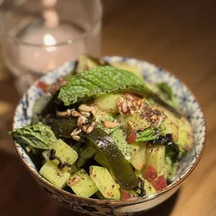 a bowl of vegetables and a glass of water