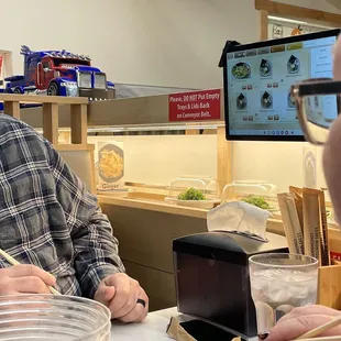 Conveyer belt on bottom and train on top