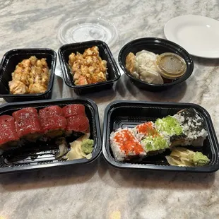 Tuna Lover Roll, Tobiko Lava Roll, Holiday Roll and fried gyoza