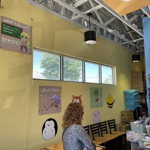 a woman standing in front of the counter