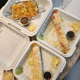 Variety of sushi rolls (baked california, tempura roll, happy roll)