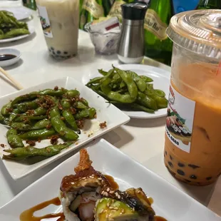 a variety of sushi dishes on a table