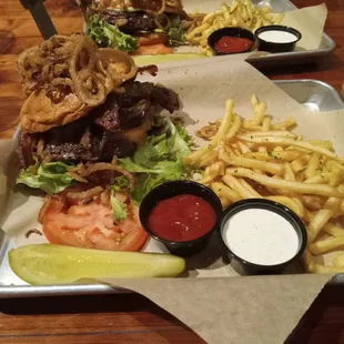 One closets is the meat lover burger,furthest back is the blue pig burger both with garlic fries on the side!!!