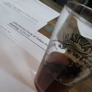 a pint of beer on a table