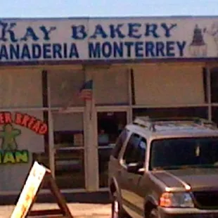 a car parked in front of the store