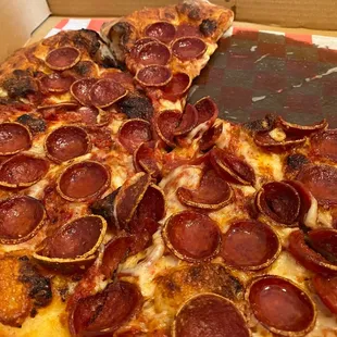 Cupping pepperoni pizza