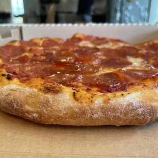 a pepperoni pizza in a box