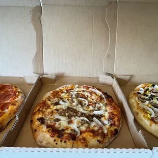 three different types of pizza