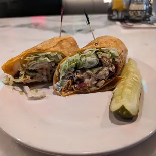 Black and blue wrap. The wrap was soggy. I had to eat the inside with a fork and skip the wrap.