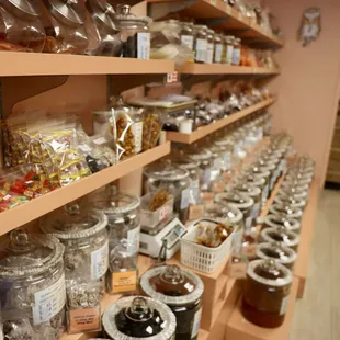 a shelf full of jars and jars