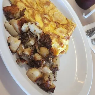 Ham n egg omelet, home fries and toast. Not good at all