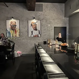 a group of people sitting at a bar