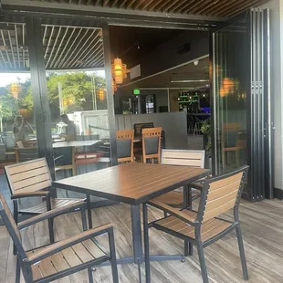 a wooden table and chairs