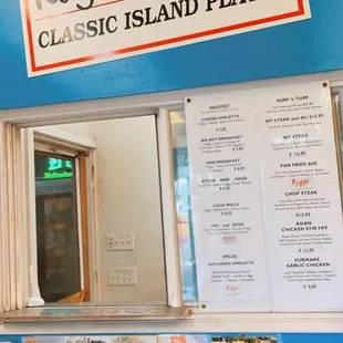 a blue wall with a menu on it