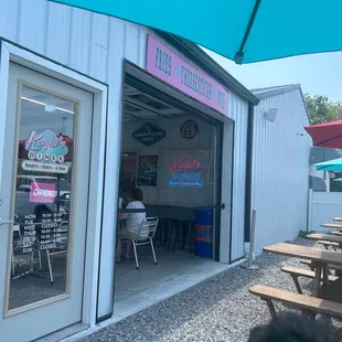 The entrance to indoor dining and tables for outside enjoyment.