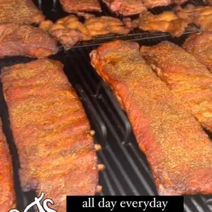 a picture of a grill full of ribs