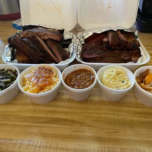 Ribs, chicken, greens, Mac and cheese, beans, potatoe salad and peach cobbler.