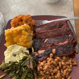 Perfectly Smoked Ribs , Mac n Cheese , Country Greens , Baked Beans ,Potato Salad and Candied Yams! Every Saturday from 12-9