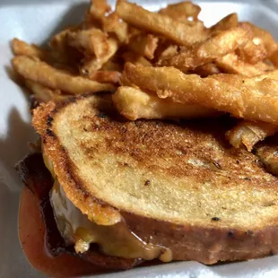 a grilled cheese sandwich and french fries
