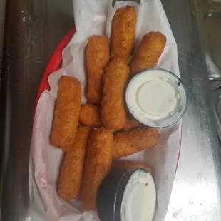 a basket of fried fish sticks
