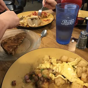 Breakfast skillet and breakfast wrap with a side of a pancake and a couple slices of rye toast. Yummy!
