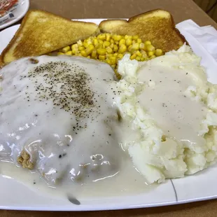 Chicken fried steak with sides of corn and mashed potatoes.  Was great!