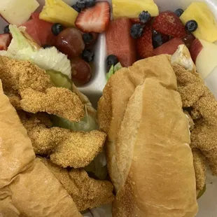 Catfish Po&apos;Boy with a side of fresh cut fruits