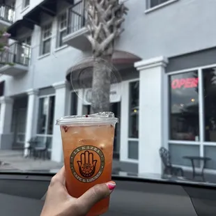 Peachy Rosey Tea and outside of store