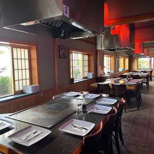 an empty restaurant with tables and chairs
