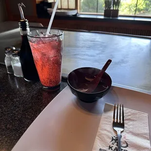 a plate of food and a drink on a table