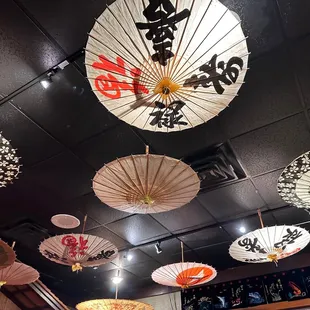 japanese umbrellas hanging from the ceiling