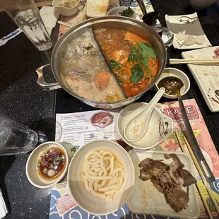 Udon, bone marrow and tomato broths, combination of meats and dipping sauce