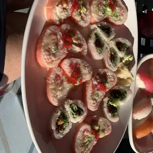 a plate of sushi rolls
