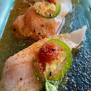 a close up of a plate of sushi