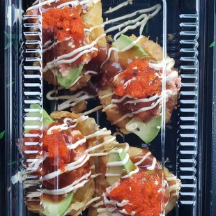 Sweet potato sliders : sweet potato tempura topped with avocado, spicy tuna, masago and Juan's house sauce &amp; mayo