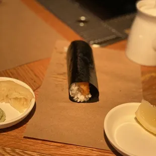 a sushi roll with a side of potato chips