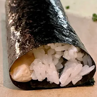 a closeup of a sushi roll with white rice