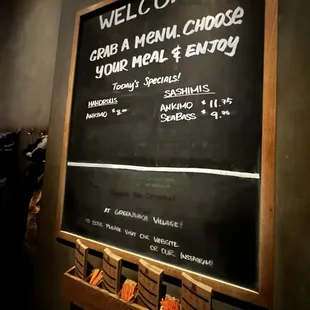 Chalk board with daily specials and menus below