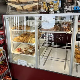 a display case filled with donuts