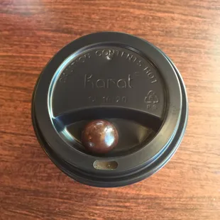 Latte, with absolutely delicious chocolate covered coffee bean.