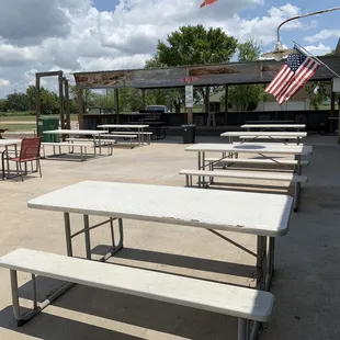 a picnic area with tables and benches