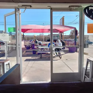 a view of a patio through a glass door