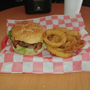 a hamburger and onion rings
